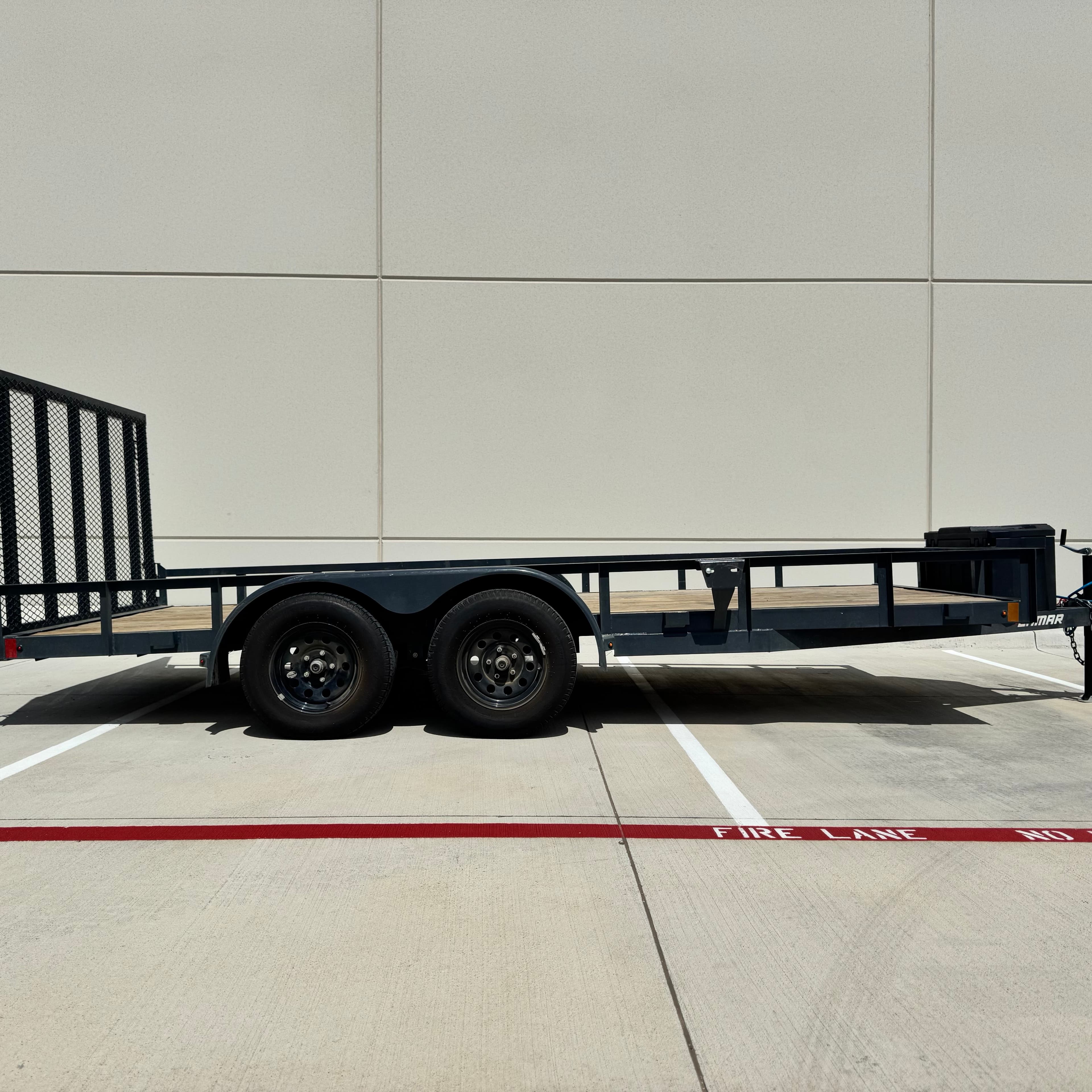 16ft utility trailer rental Fort Worth TX - versatile utility trailer with wooden deck and mesh ramp for landscaping hauling